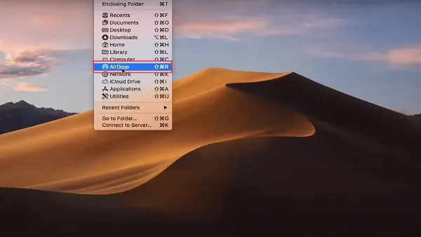 Mở Finder trên Macbook và tìm đến thư mục chứa ảnh bạn muốn chuyển.